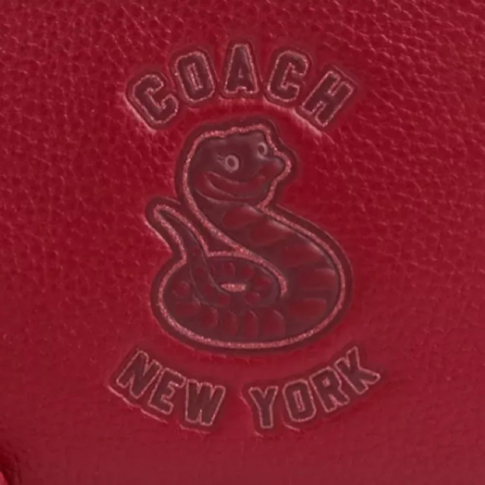 Coach 🆕 lunar new year collectible Wristlet With Graphic year of the snake…